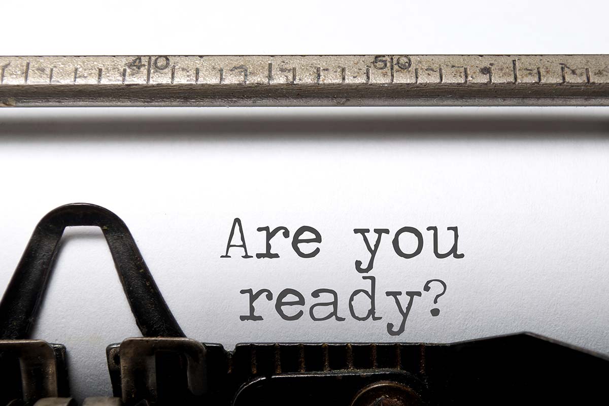 Paper in a typewriter with the words "are you ready?"