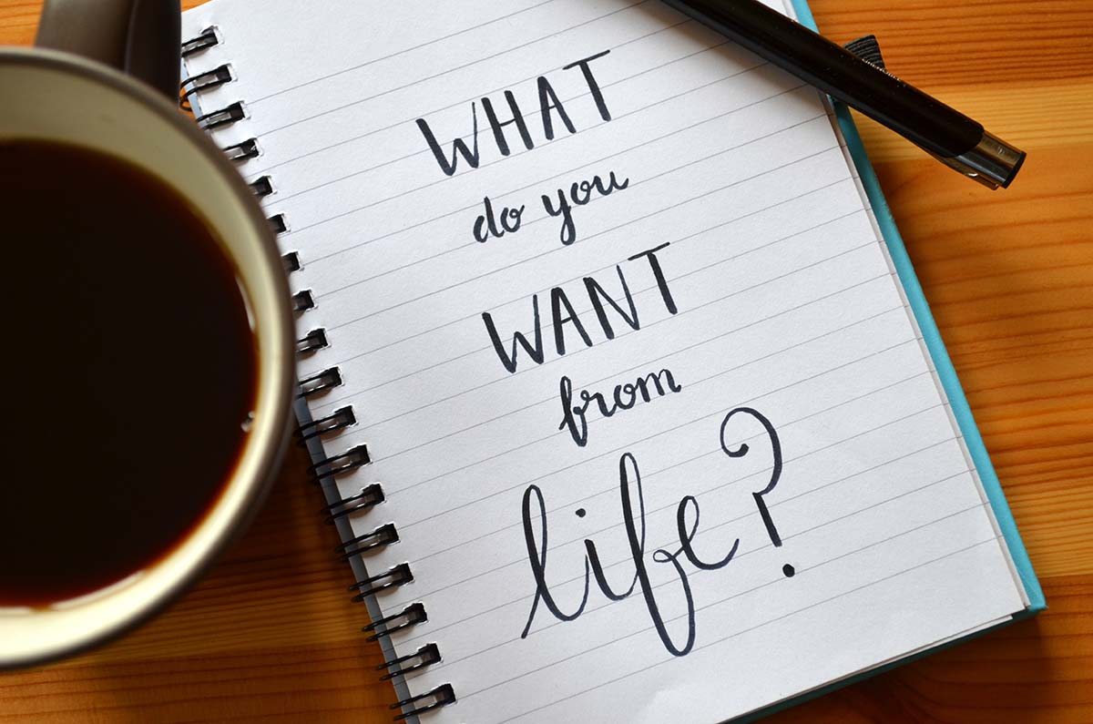 An open notebook with the words "what do you want out of life